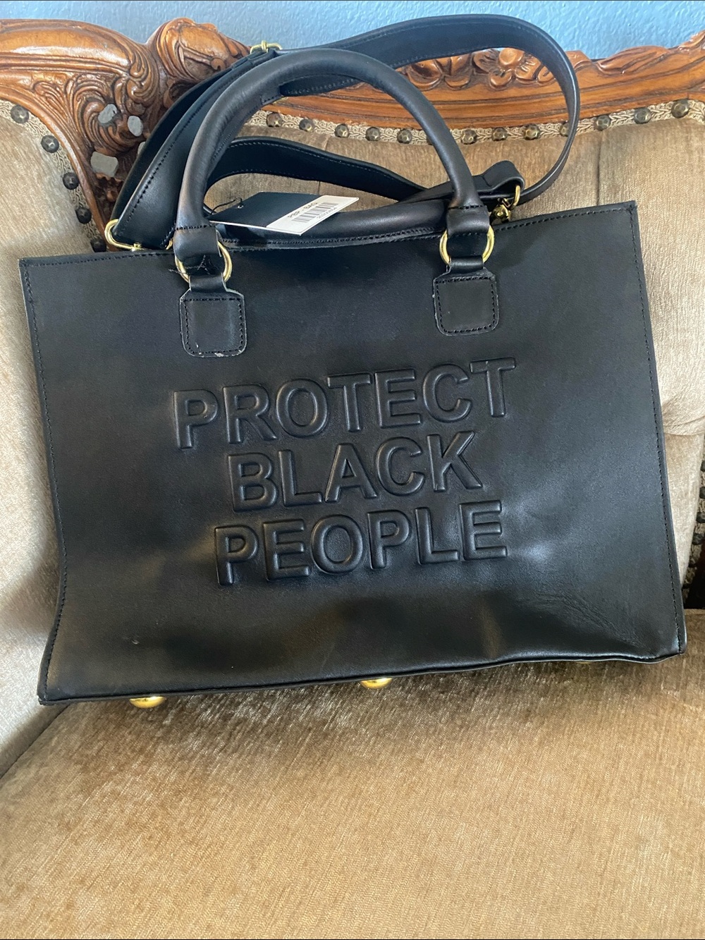 Black Statement Tote Bag with 'Protect Black People' Embossed Text